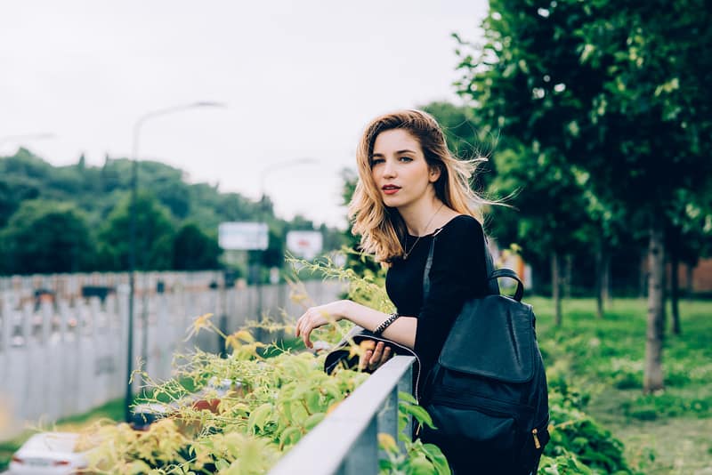 Young woman outdoor serene confident
